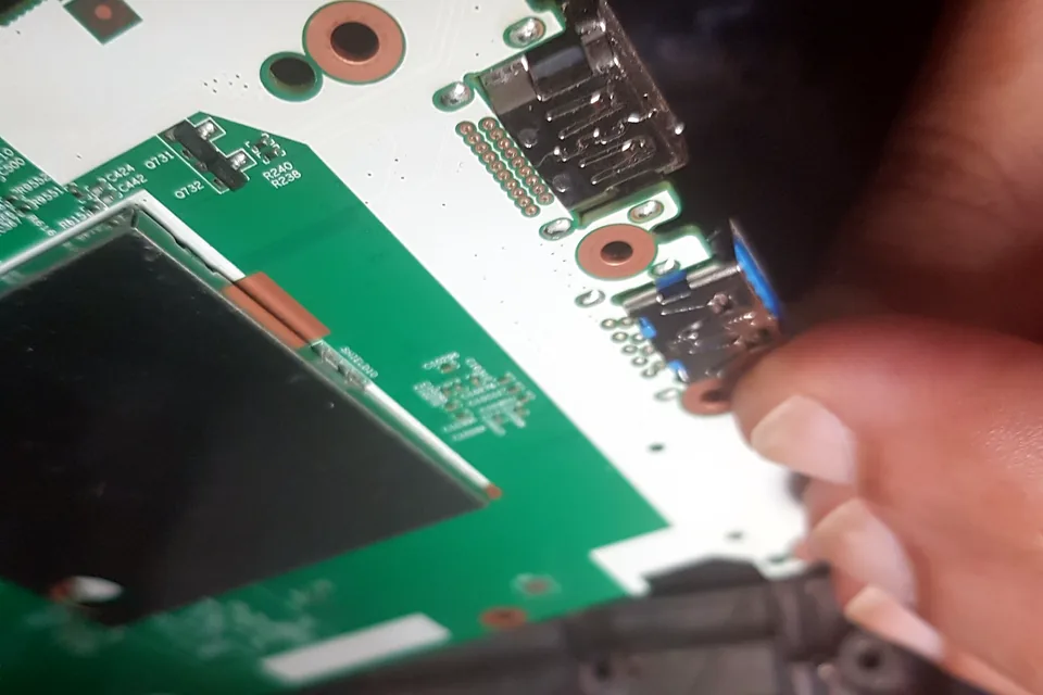 Console circuit-board port inspected during repair